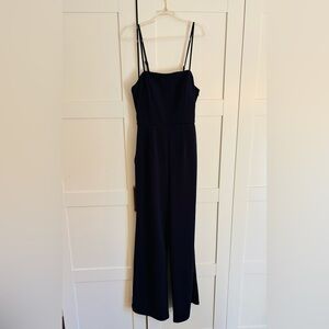 Altar’d state navy blue jumpsuit size small semi open back & pockets
